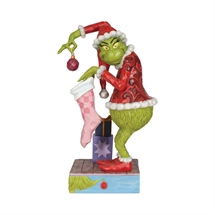 Grinch holding stocking H:20 cm.